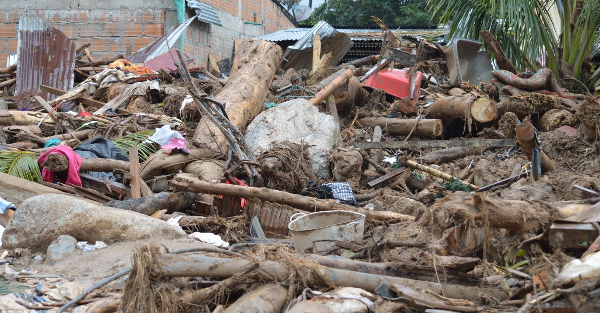 Destruction in Mocoa, Colombia due to natural disaster. Damaged structures and debris.